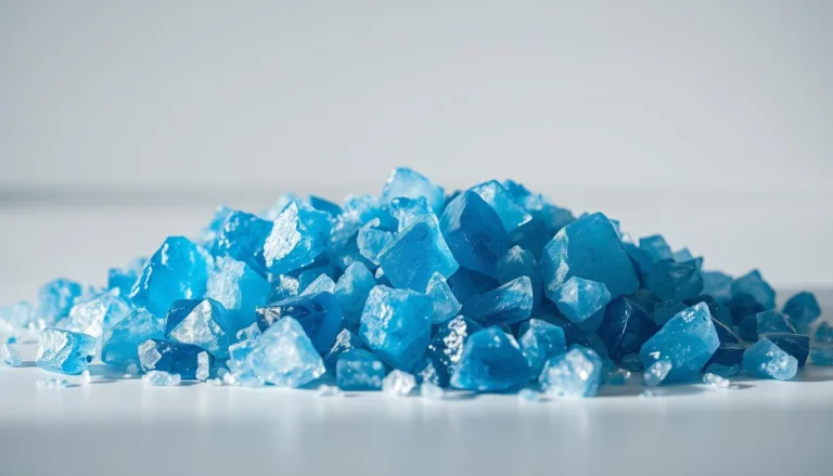 Persian blue salt crystals scattered on a flat surface, highlighting their natural vibrant blue color and crystalline texture.